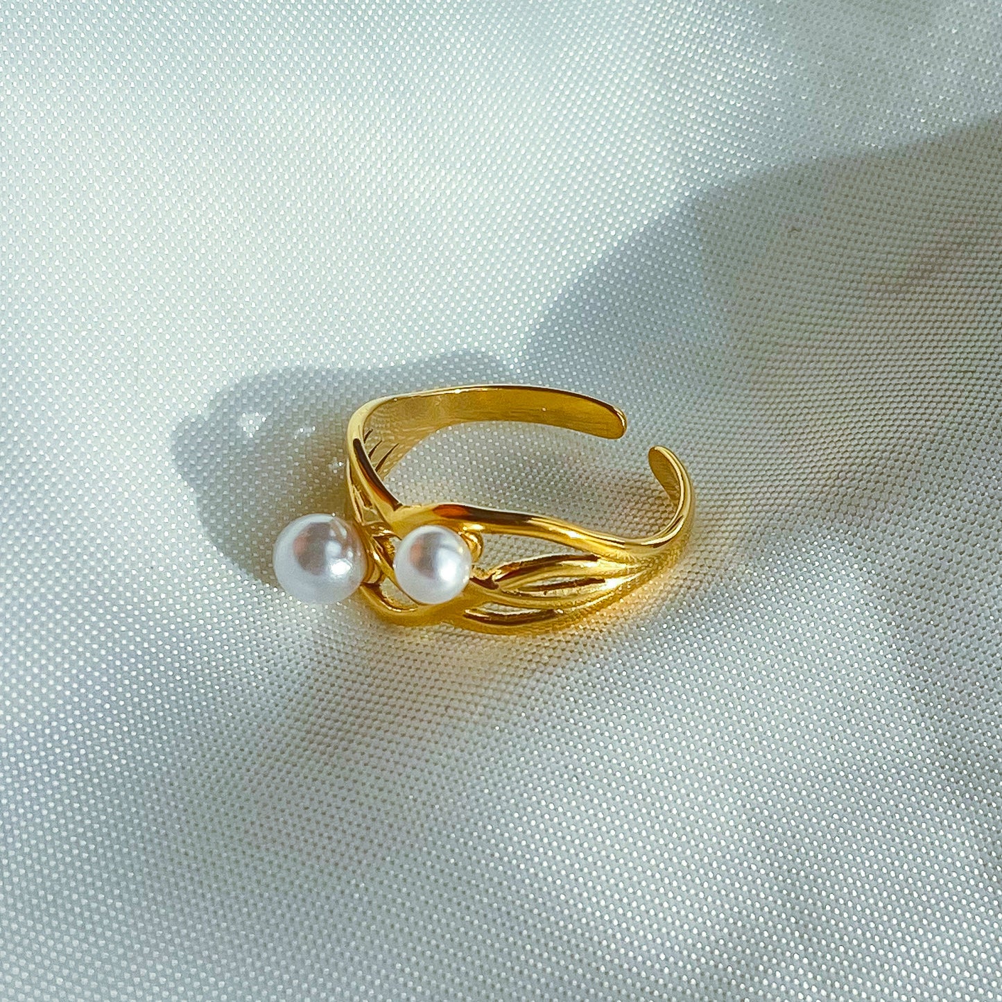 CLAIRE - ANILLO CRUZADO PERLAS ACERO INOXIDABLE