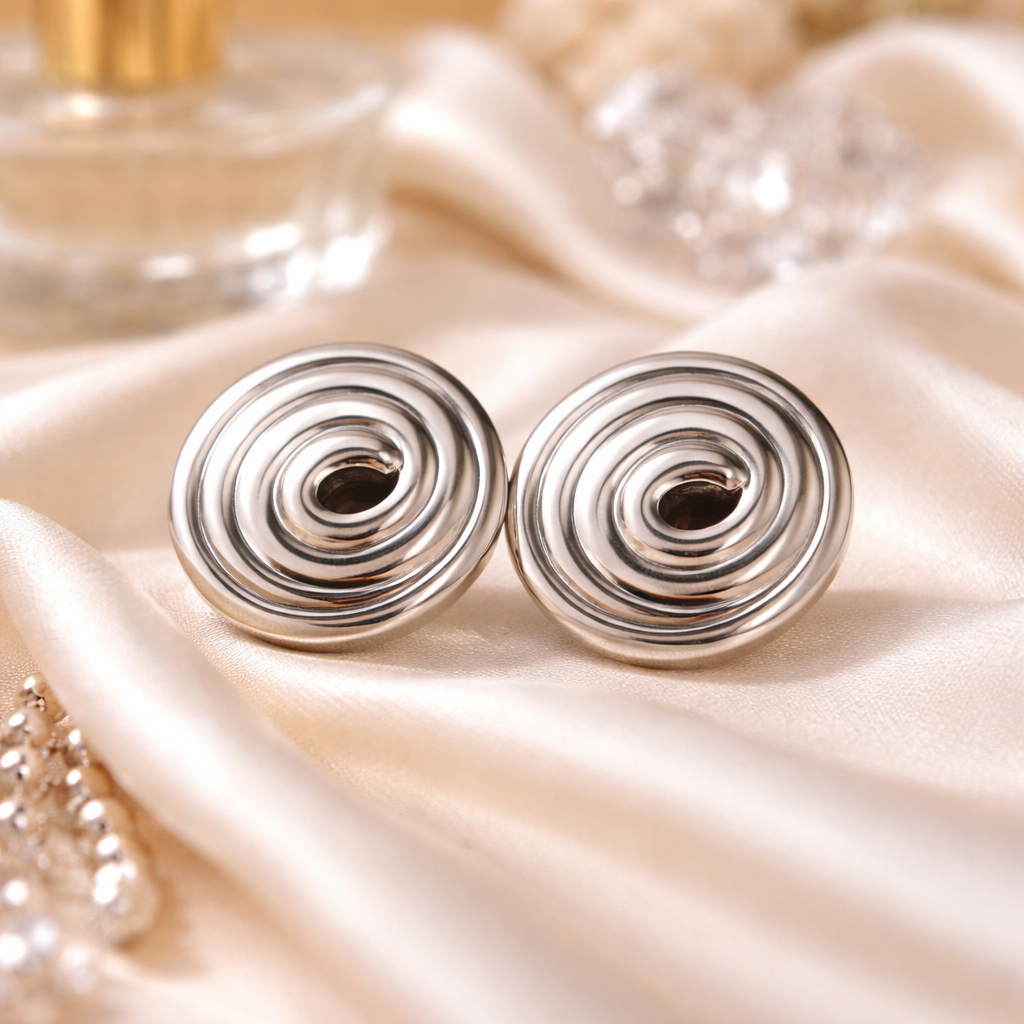 DAYANA - Aretes caracol acero inoxidable