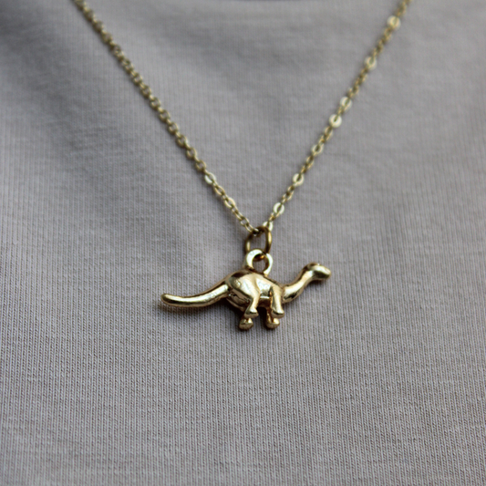DINORA- COLLAR DINOSAURIOS CHAPA DE ORO