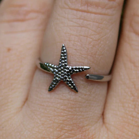 LUZMA - ANILLO ESTRELLA DE MAR AJUSTABLE CRUZADO ACERO INOXIDABLE