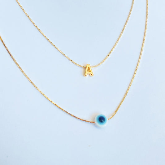 MAYCE - COLLAR INICIAL Y OJO AZUL CHAPA DE ORO