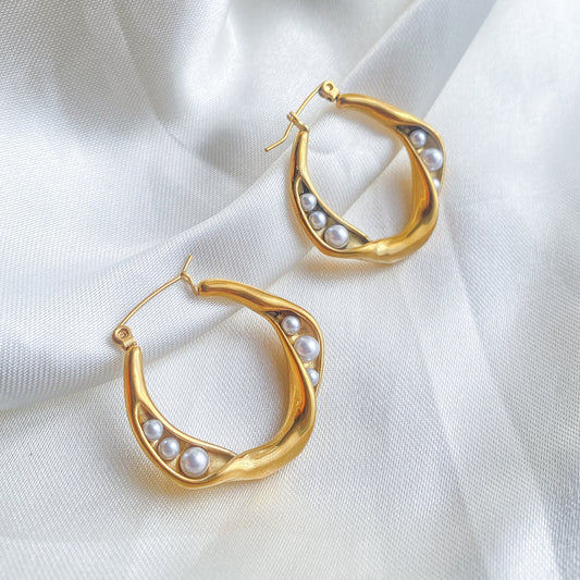 ARIANE - ARRACADA TORCIDA CON PERLA ACERO INOXIDABLE 30 MM